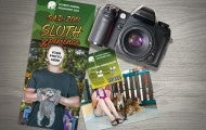 Photo collage of a roadside zoo brochure, ticket, a camera and a photograph of a girl with baby tigers.