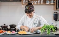 Chef Adriele Carvalho prepares ingredients for her plant-based take on a Brazilian stew.