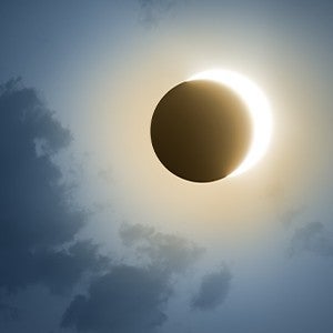 A near-total solar eclipse in a dark sky