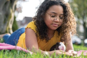 Photo of girl with a guinea pig