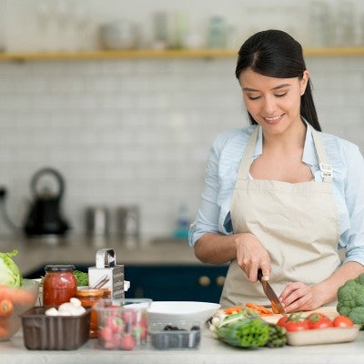 Woman preparing a plant based meal
