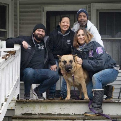 Pets for Life team with client in Detroit on front porch