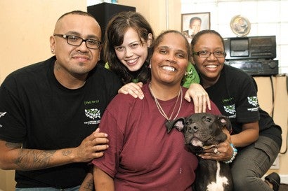 Portrait of PFL employees and care recipient and dog