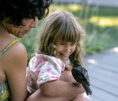 Kitty Block and her mother when she was a child, holding a bird