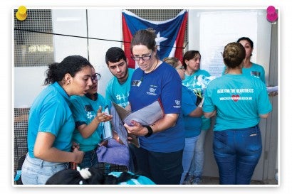 Hilary Hager instructs volunteers during  Spayathon™ for Puerto Rico. 