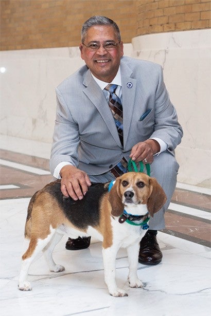 Former Massachusetts state legislator Jose Tosado with Louie, who was previously used in research.