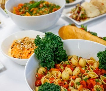 Table full of colorful vegan dishes